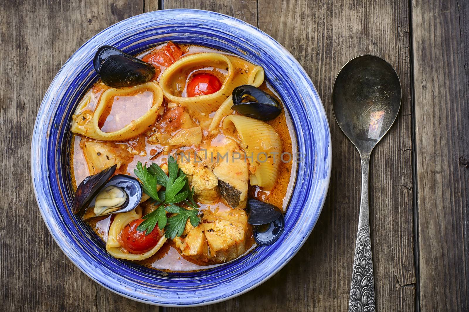 seafood soup with tomato sauce,mussels and pasta