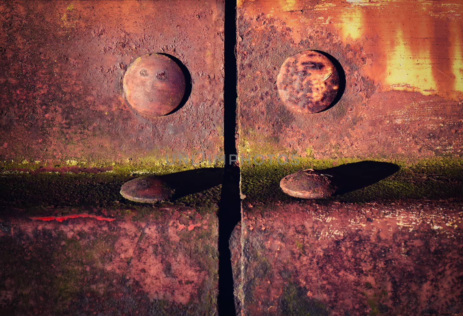 background or texture detail of an old iron fencing riveted joints