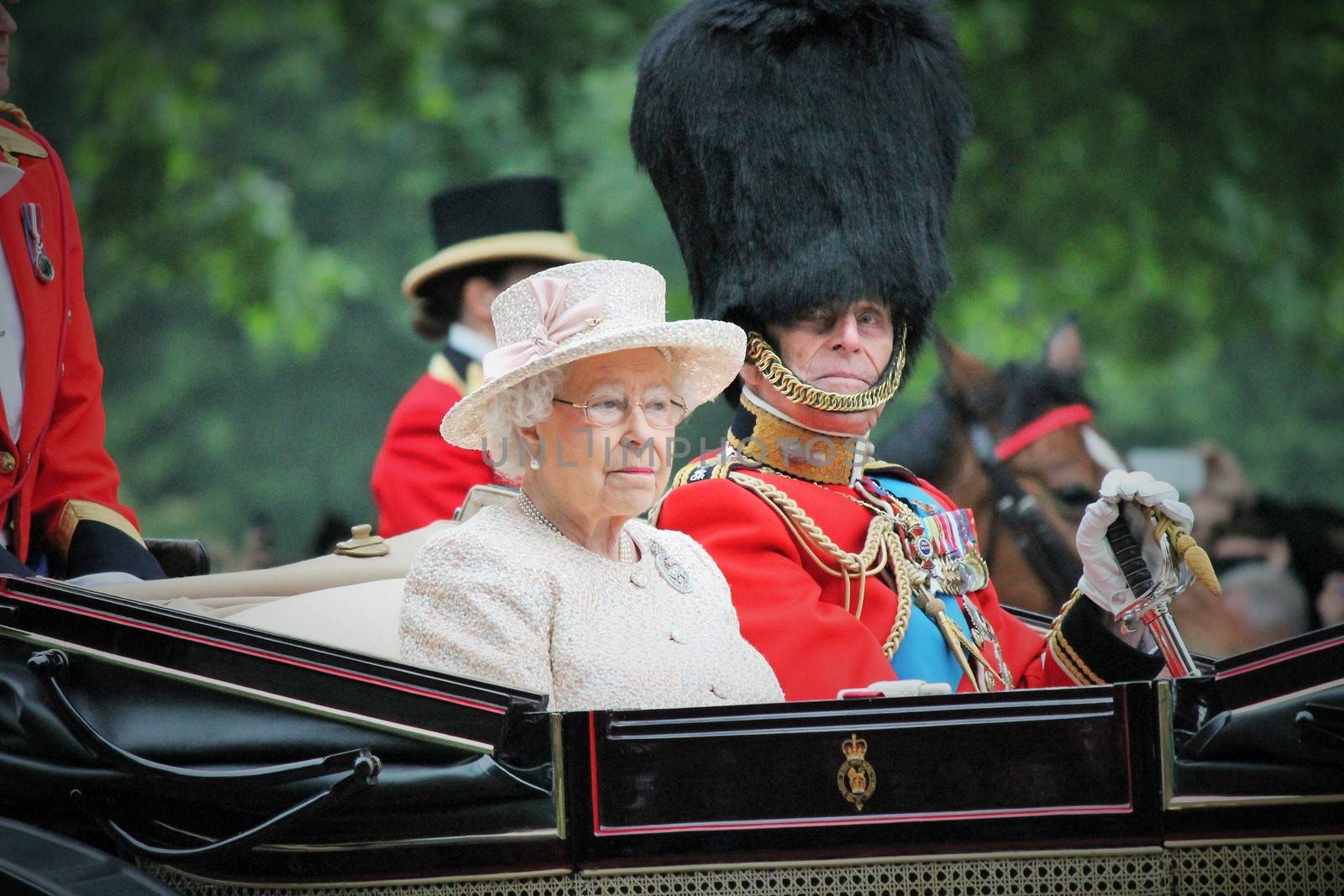 London, UK - June 13 2015: The Queen Elizabeth and Prince Phillip appear during Trooping the Colour ceremony by cheekylorns