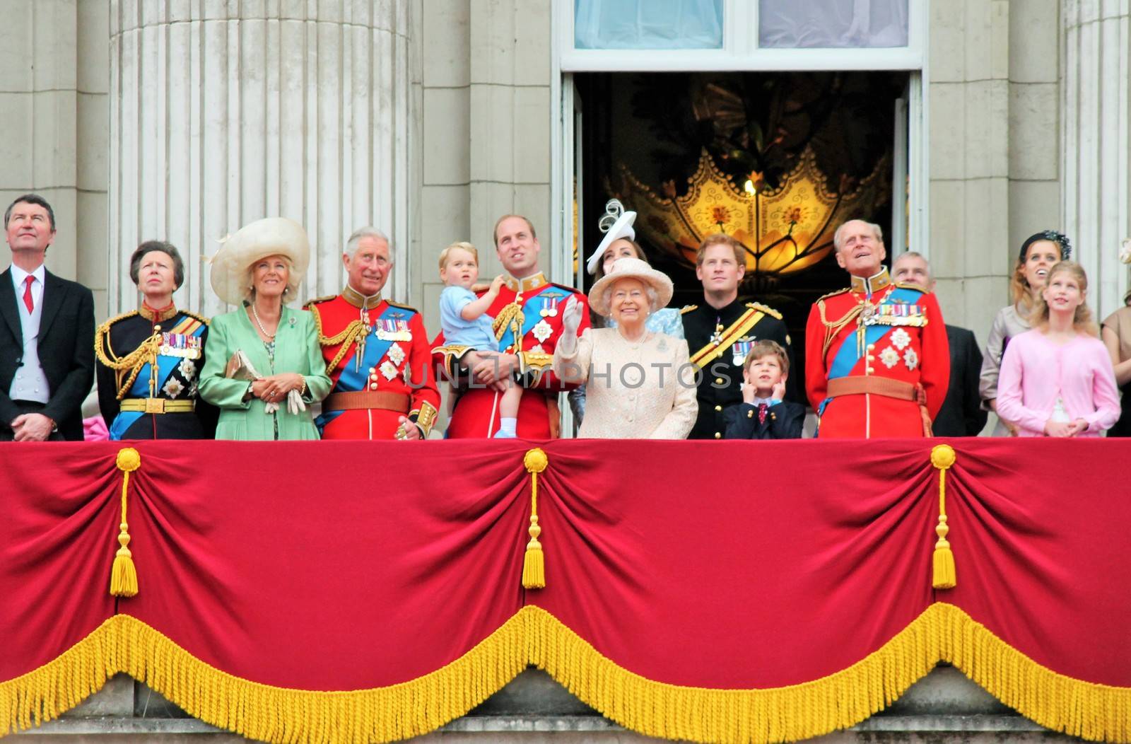 LONDON, UK - JUNE 13: The Royal Family appears on Buckingham Palace balcony during Trooping the Colour ceremony, Prince Georges first apperance on Balcony, on June 13, 2015 in London, England, UK by cheekylorns