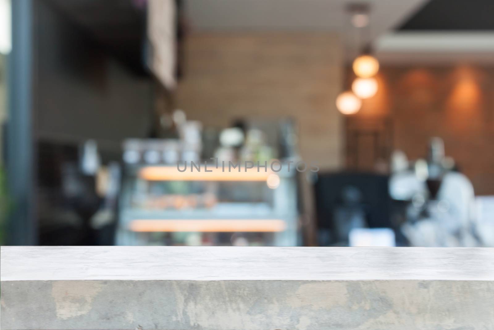 Empty concrete table top with blurred coffee shop by punsayaporn