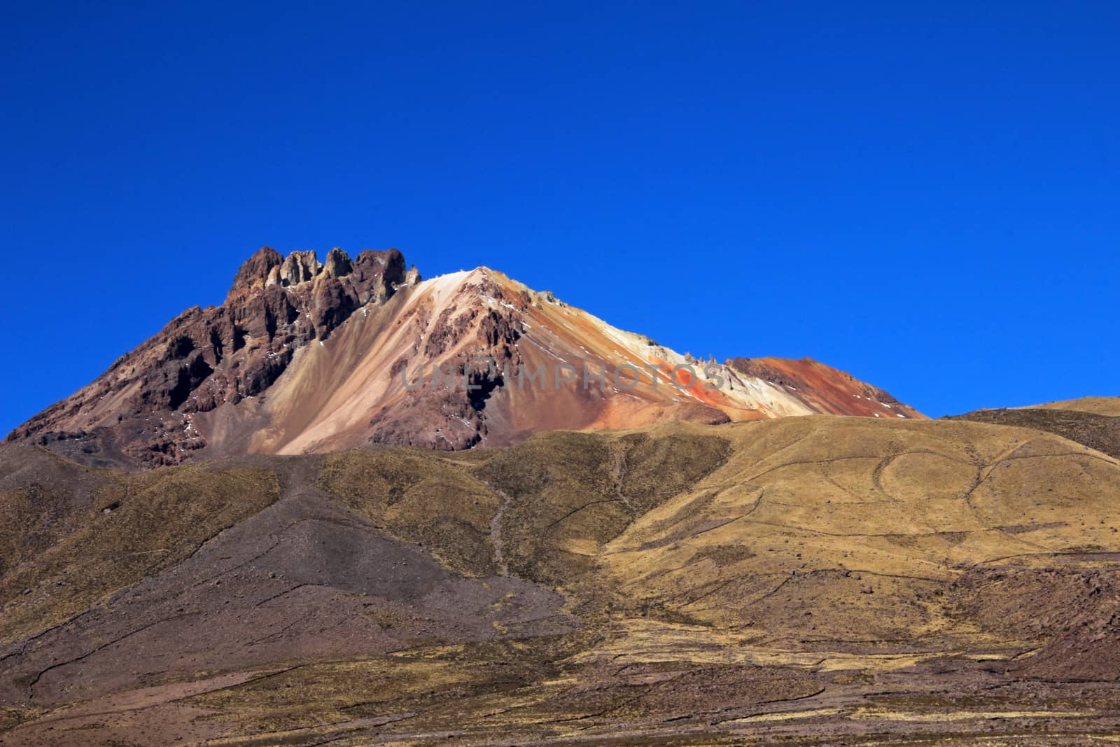 Very colorful dormant volcano Tunupa, the Salar de Uyuni, Bolivia