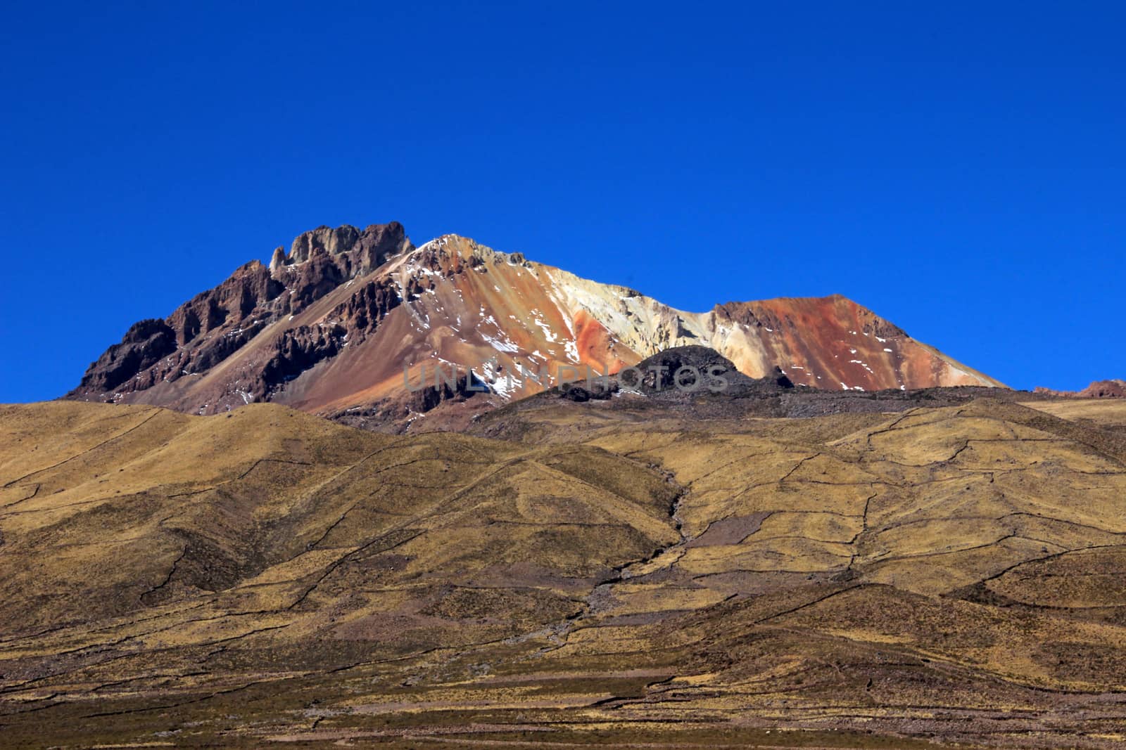 Very colorful dormant volcano Tunupa, the Salar de Uyuni, Bolivia