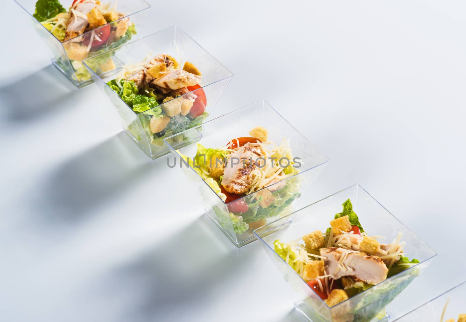 Salad with chicken and crackers in glass by kzen
