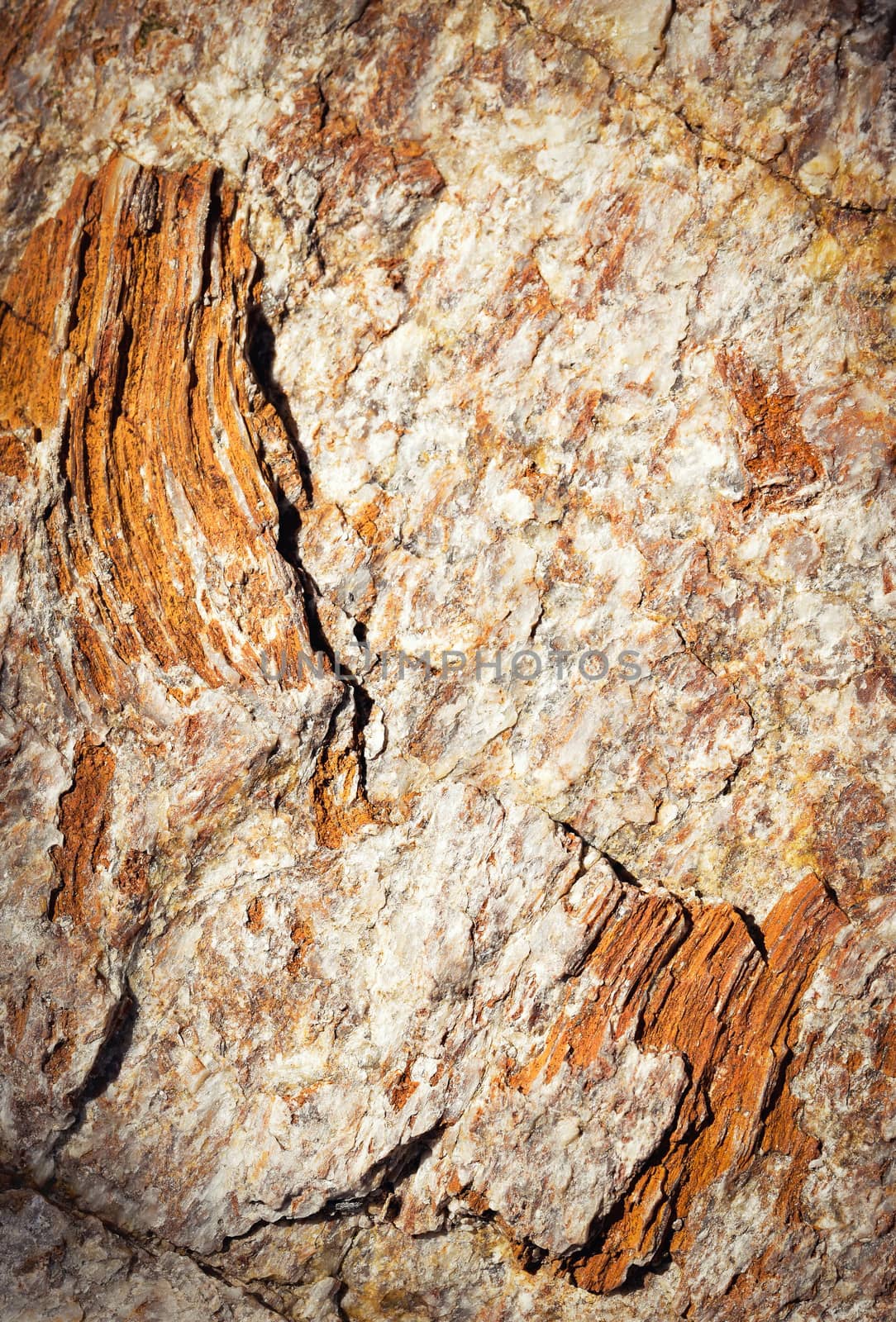 abstract background detail mica rocks of ocher and orange color