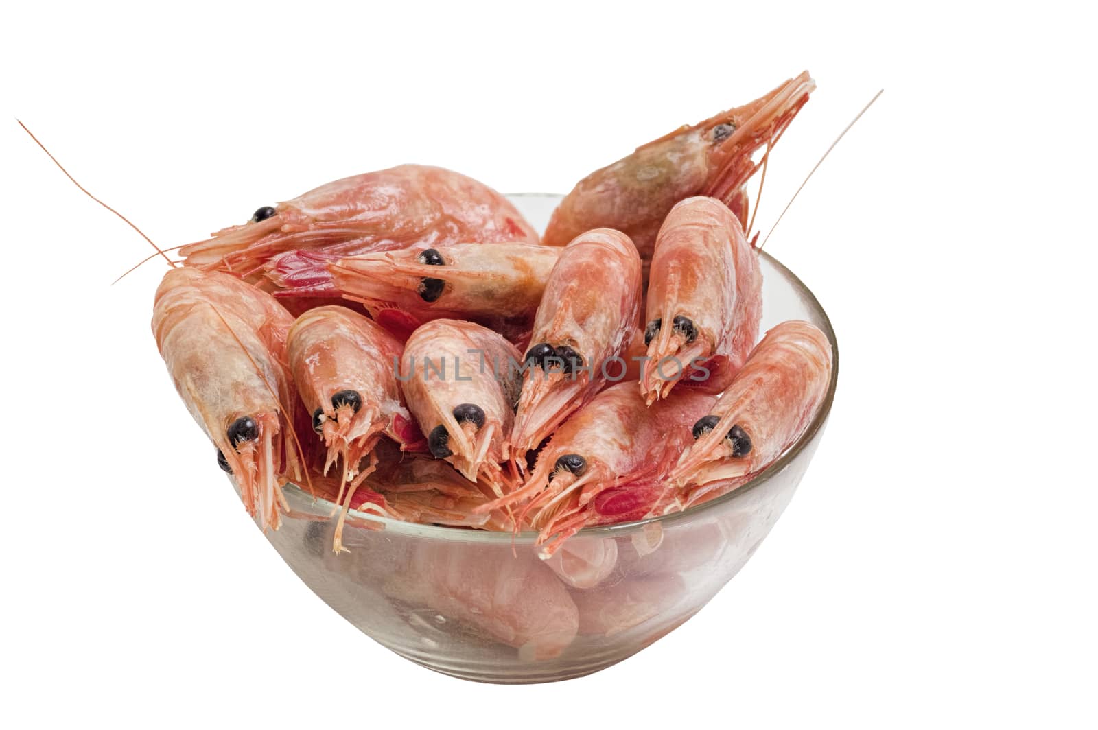 Red peeled prawns lie on a saucer isolated on white background