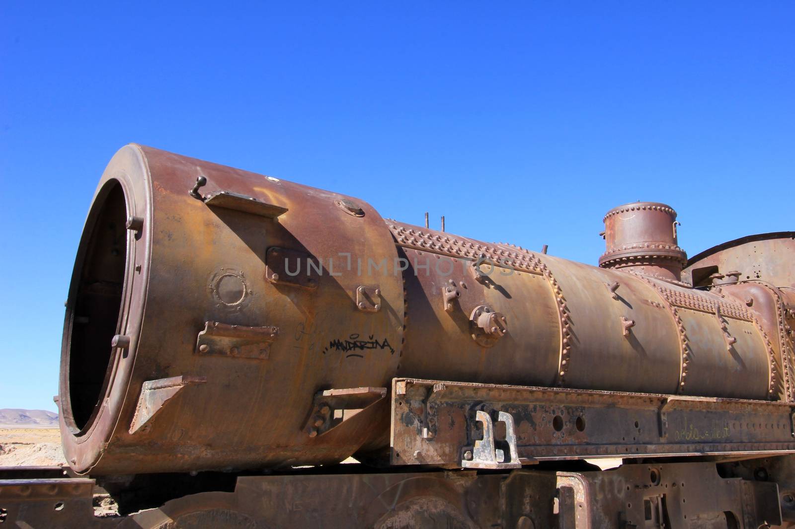 Graveyard of rusty old trains in the desert of Uyuni, Bolivia