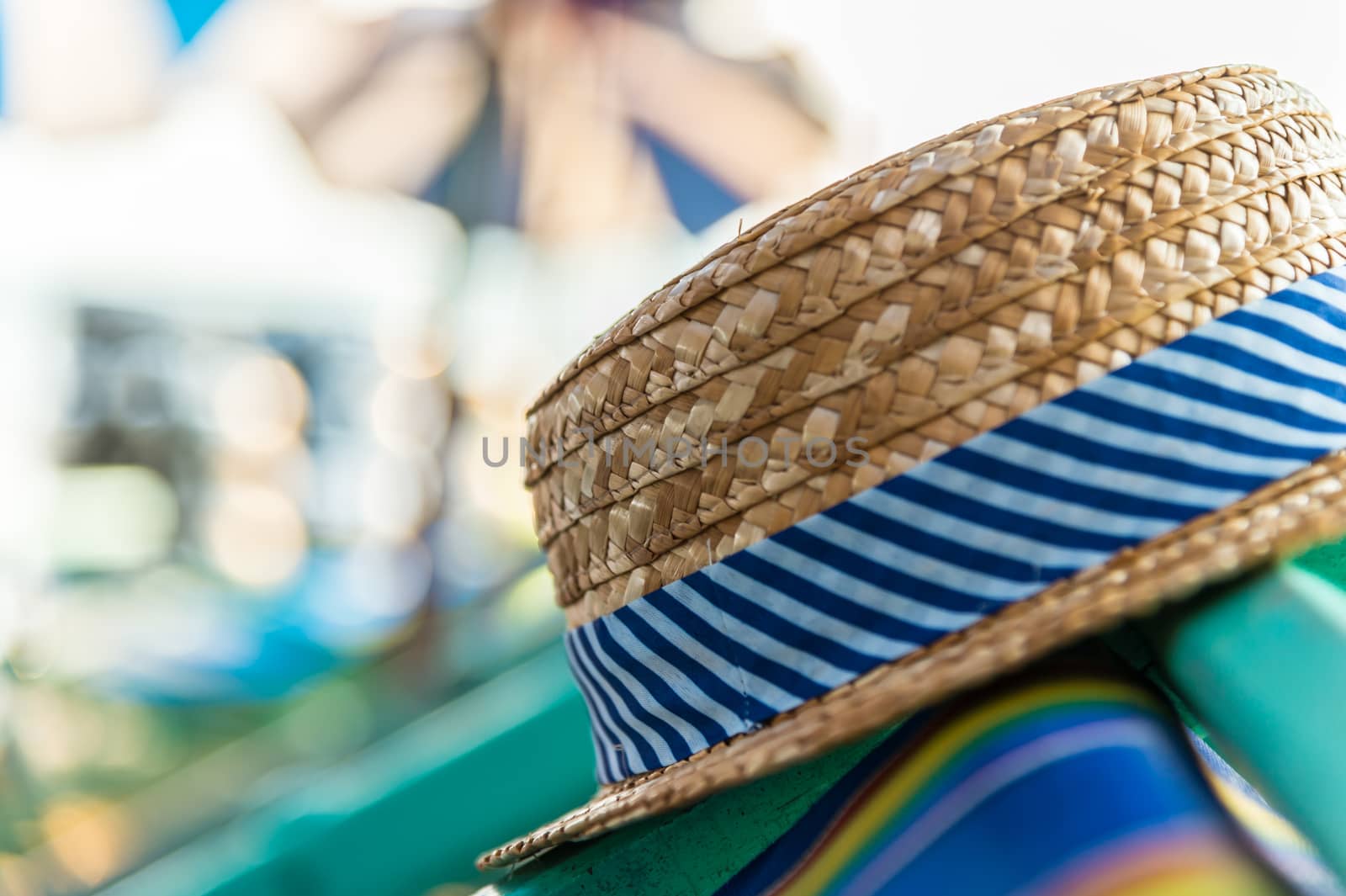 Woven hat on the beach chair by luckyfim