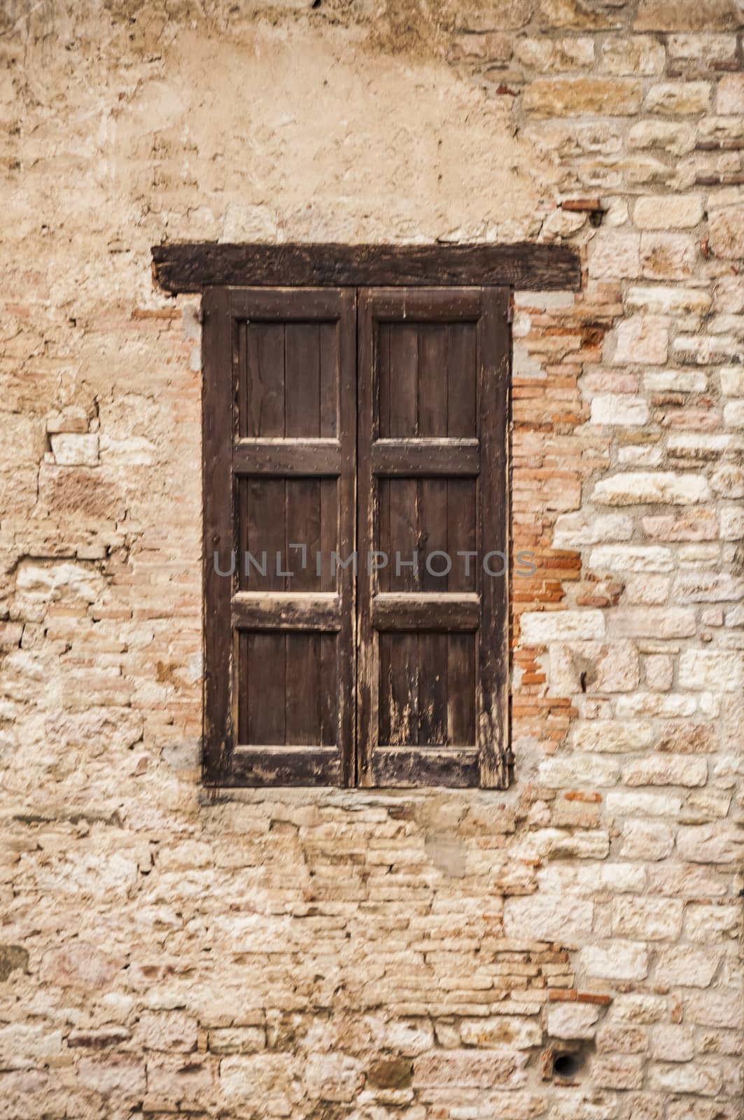 Window on the Facade of Italian stone wall