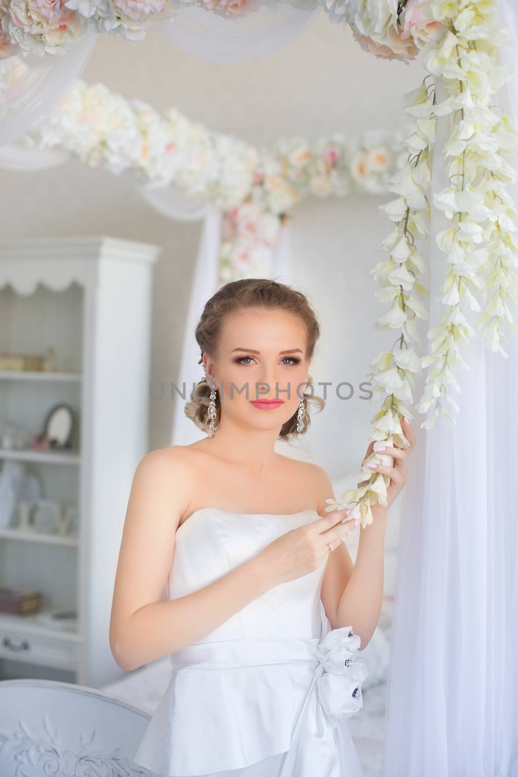 Portrait of a girl in a white dress close-up