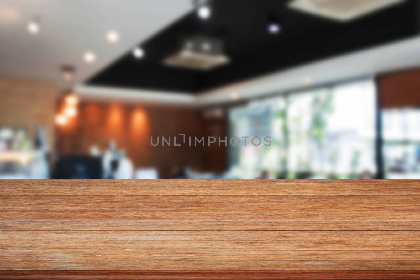 Top of wooden table with blurred cafe by punsayaporn