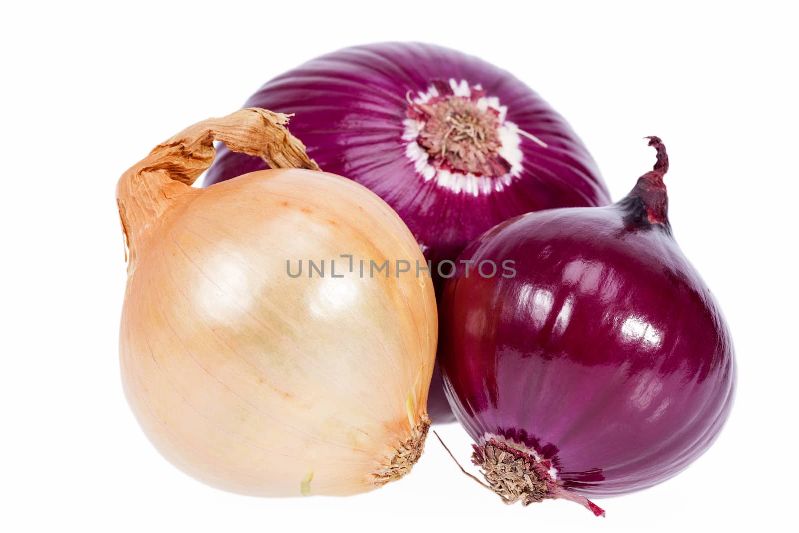 Group of red and yellow onions isolated on white background closeup