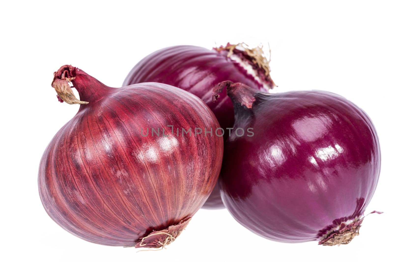 Group of red onions isolated on white background, closeup