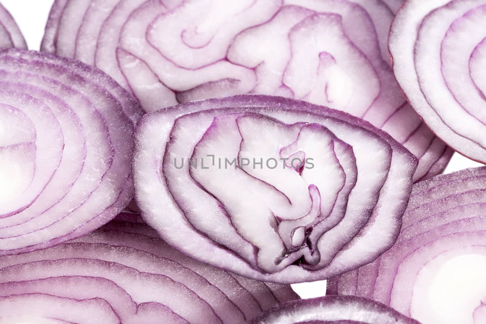 Slices of red onion on white background, close up by mychadre77