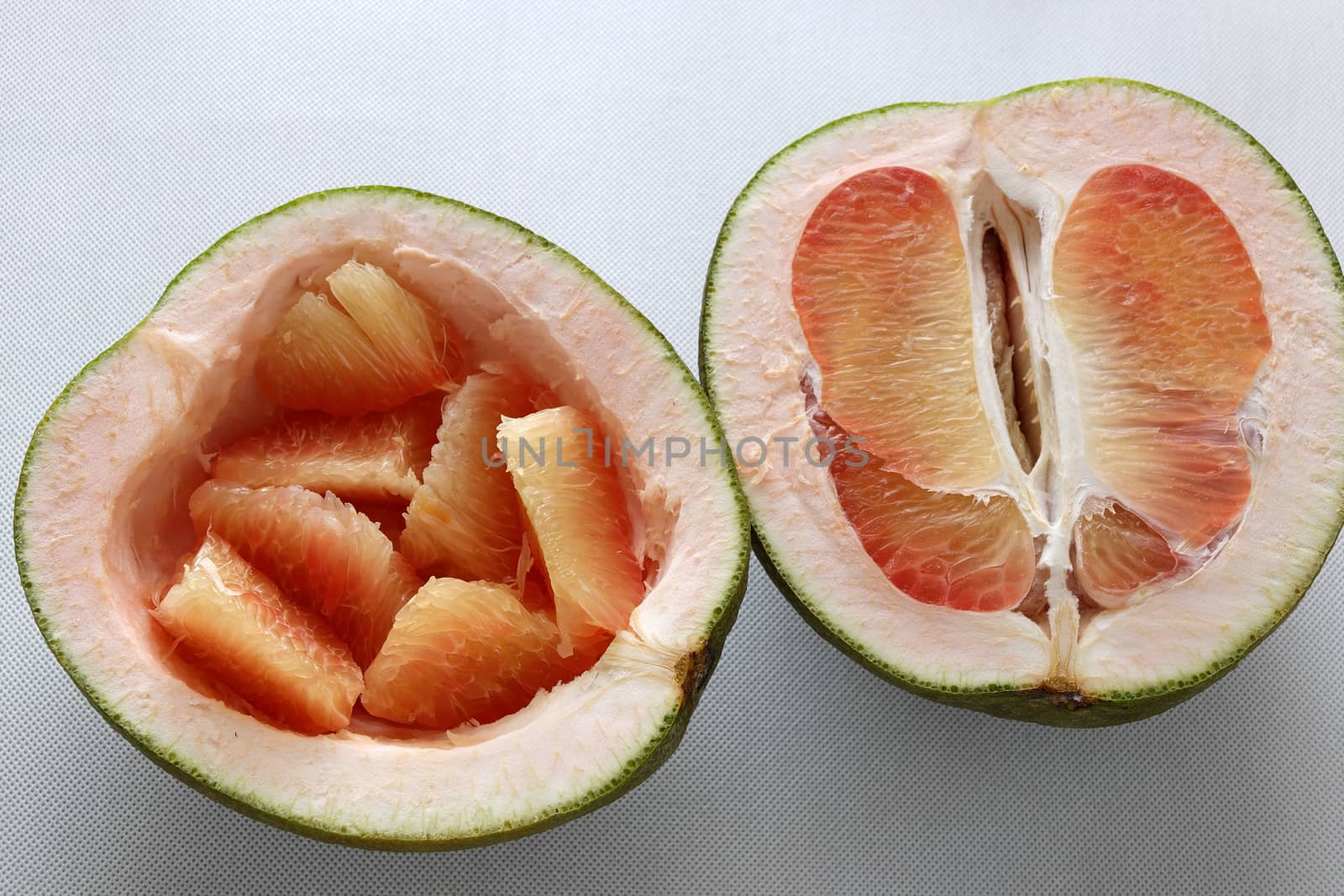 Grapefruit on white background, tropical fruit, Vietnamese agriculture product, rich vitamin A, healthy eating, reduce cholesterol, prevent kidney stones, oxidation, anti cancer, make lose weight