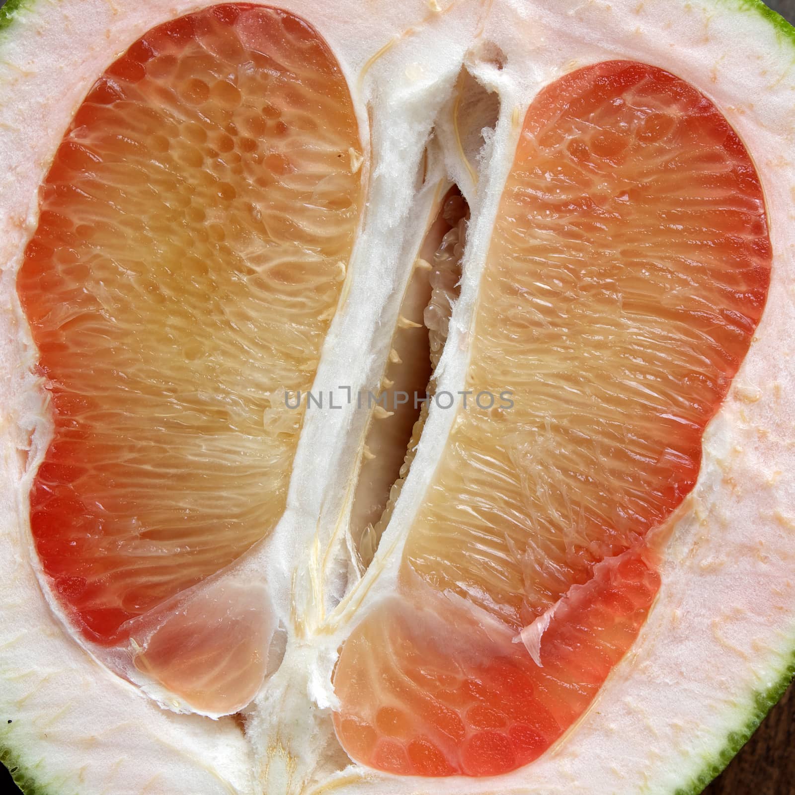 Grapefruit on wood background, tropical fruit by xuanhuongho