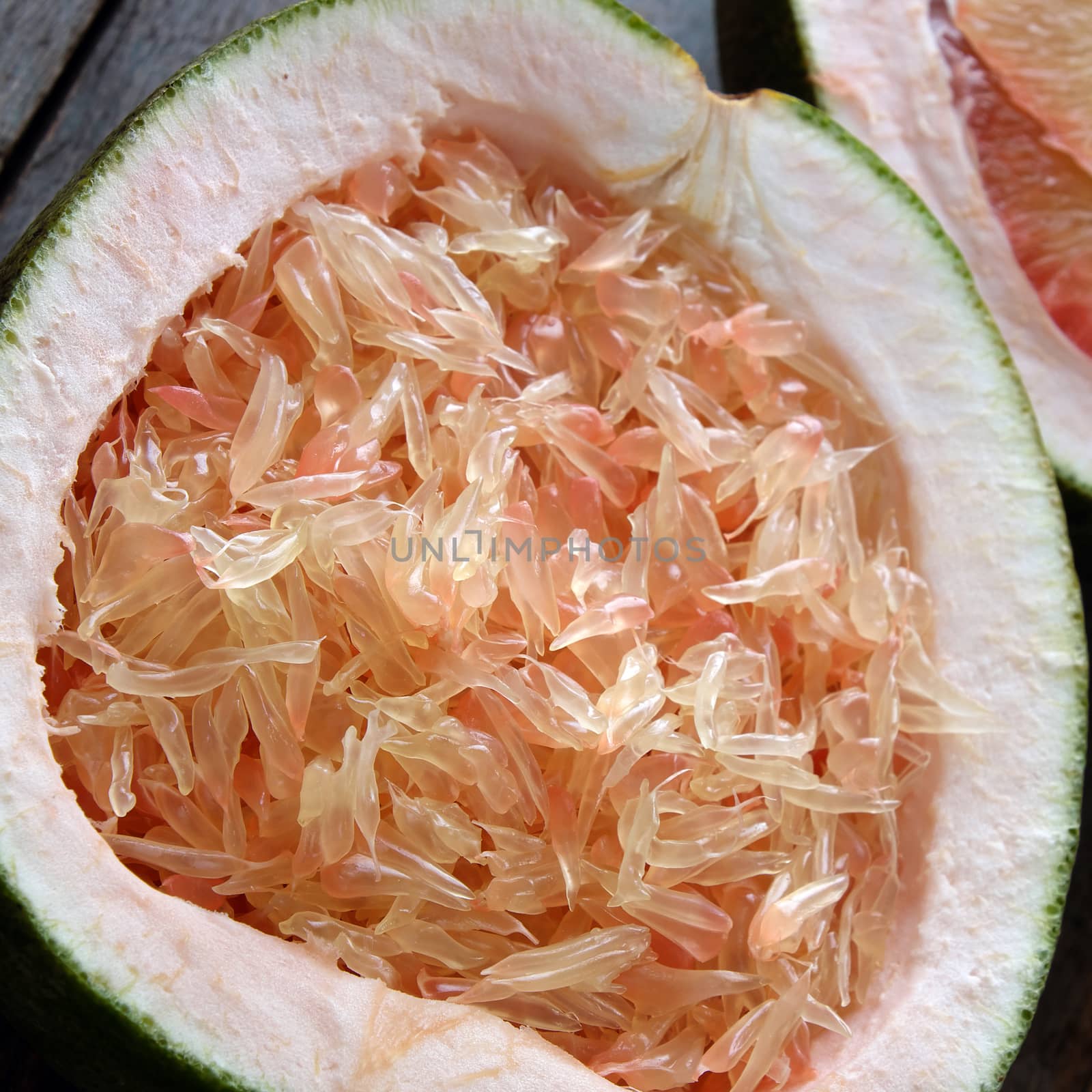 Grapefruit on wood background, tropical fruit by xuanhuongho