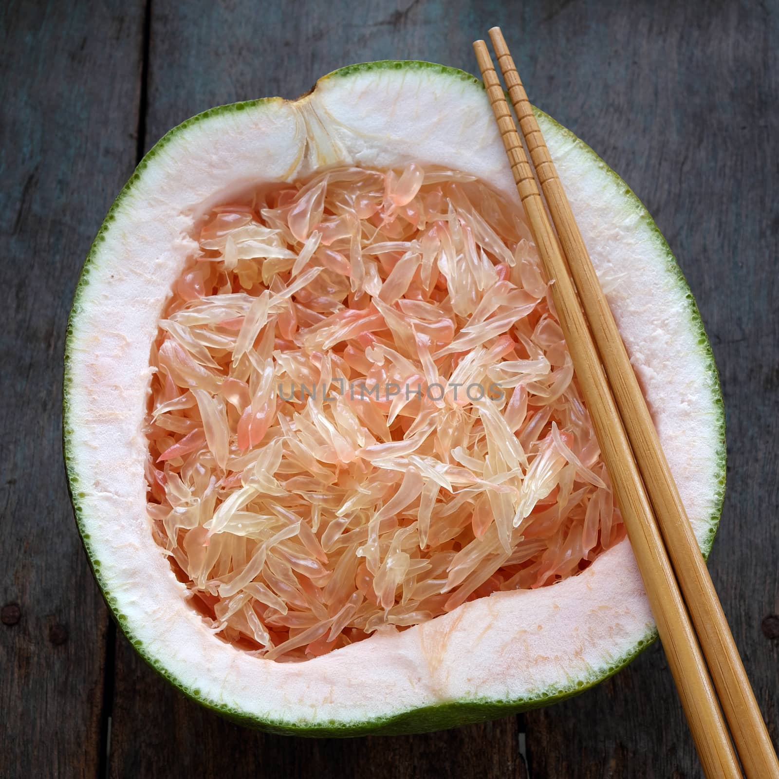 Grapefruit on wood background, tropical fruit by xuanhuongho