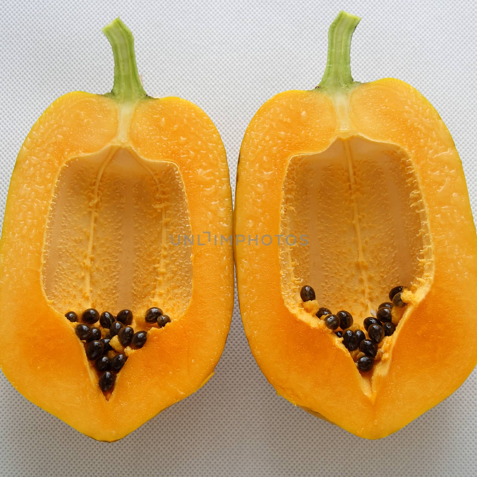 Papaya on white background, tropical fruit by xuanhuongho