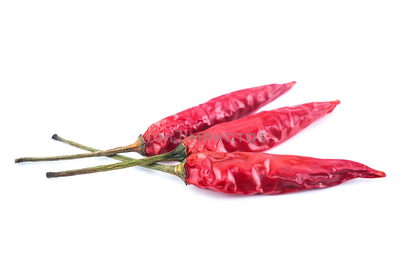 Dried red chili peppers isolated on white background. Food ingredient for spicy cooking.