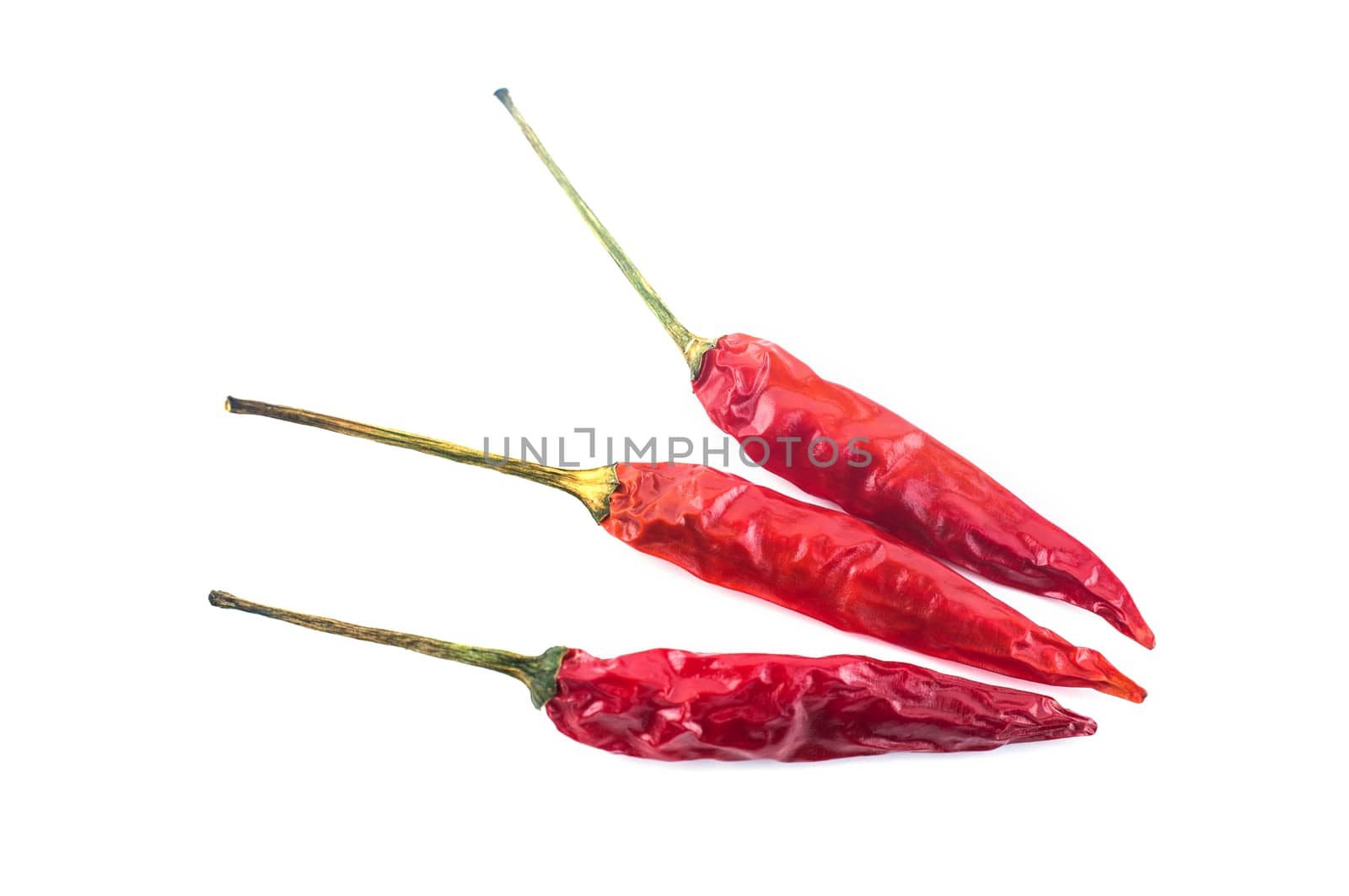 Dried red chili peppers isolated on white background. Food ingredient for spicy cooking.