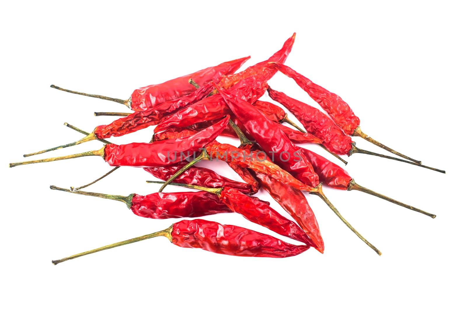 Dried red chili peppers isolated on white background. Food ingredient for spicy cooking.