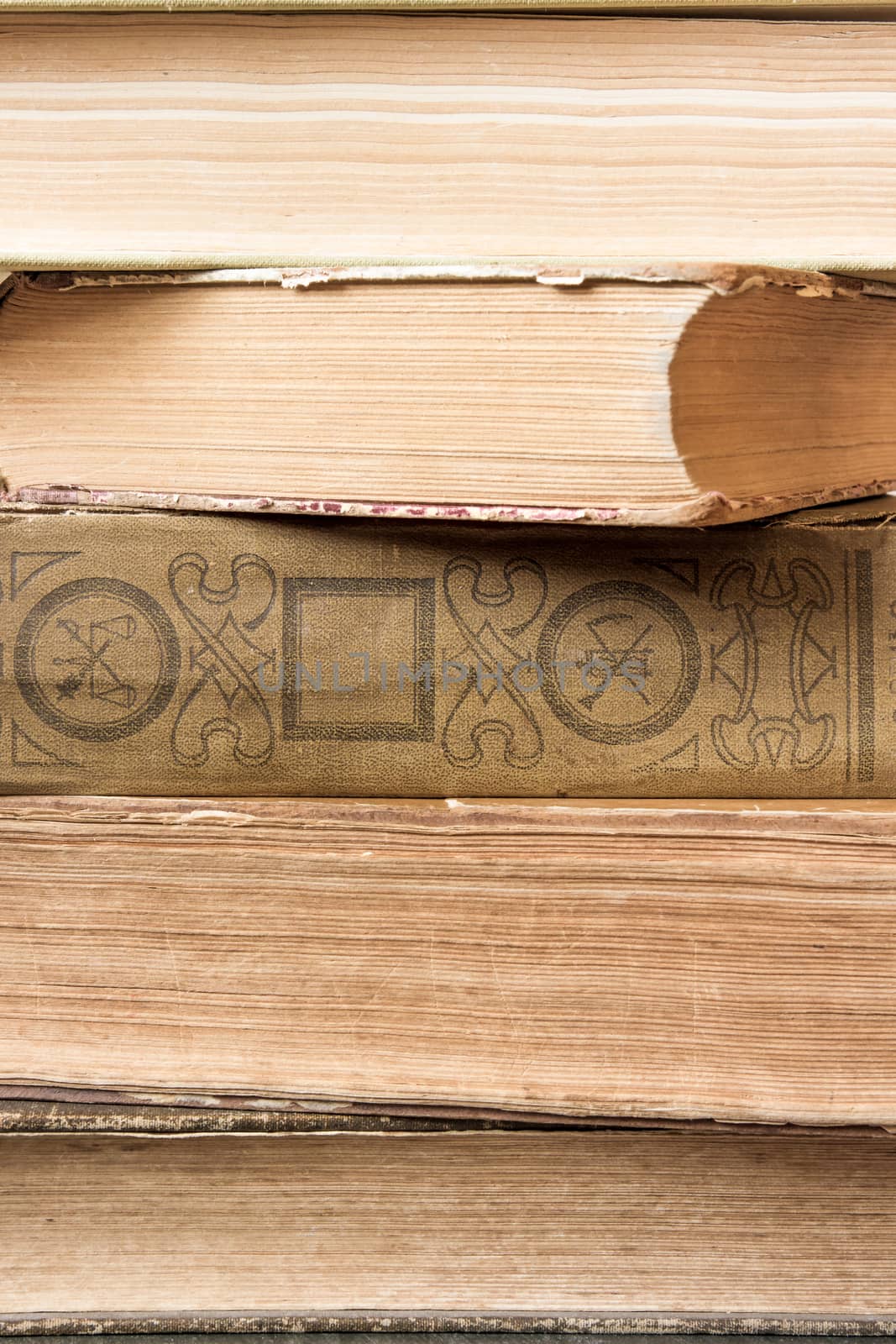 Closeup texture of old books laid in stack