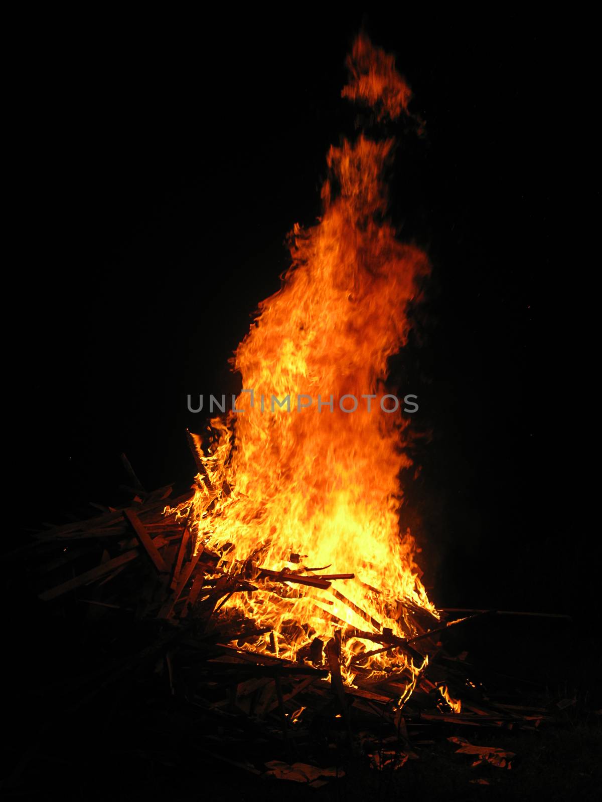 Bright orange flames in the darkness of the boards