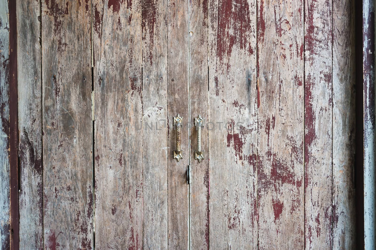 Old scratched wooden door texture background