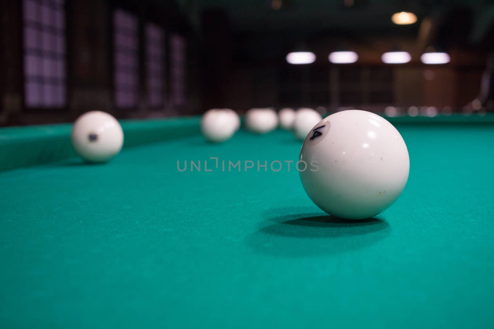 Close-up of Russian billiard, balls on green game table cloth