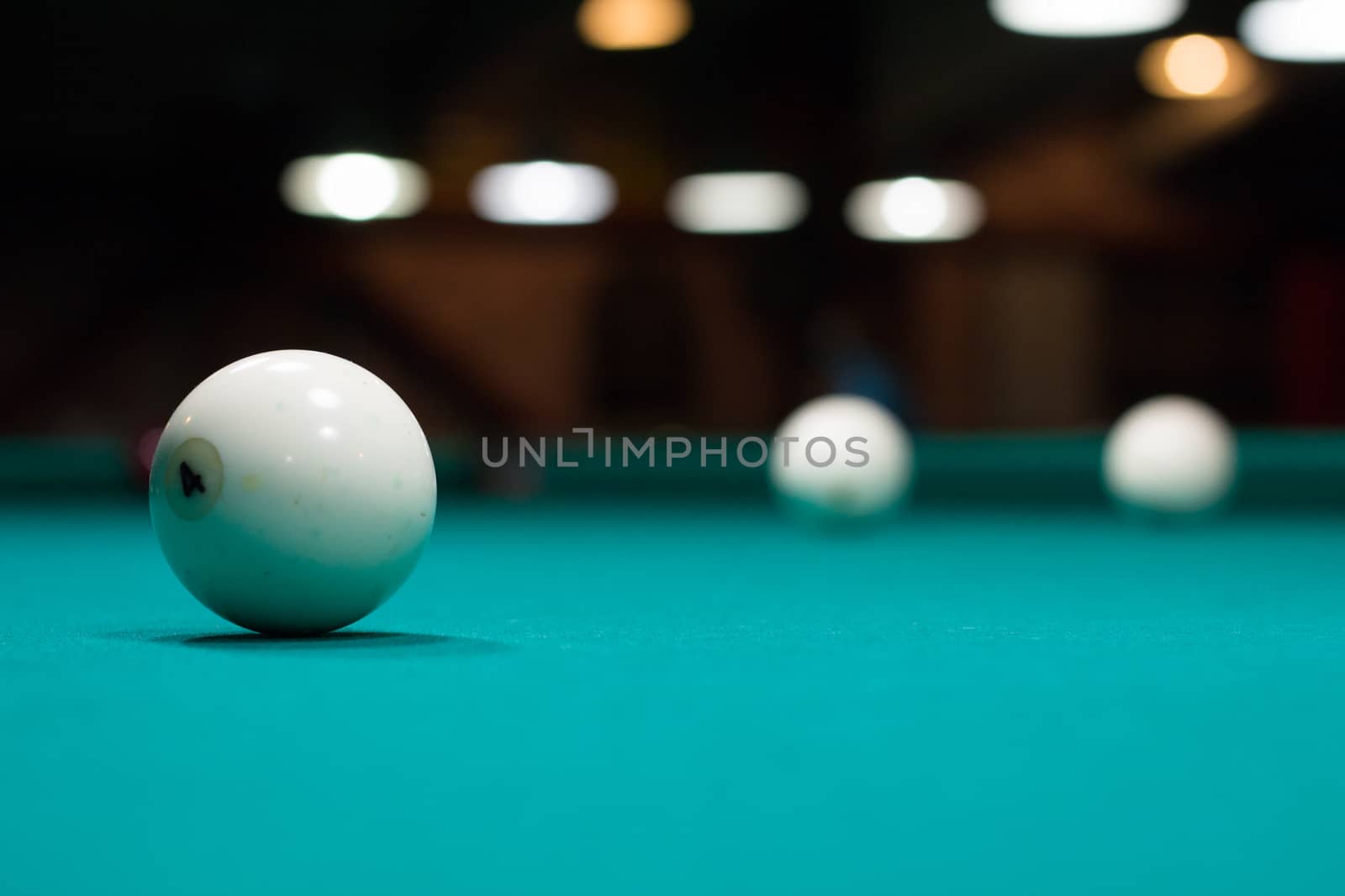 Russian billiard in club, balls on green table cloth
