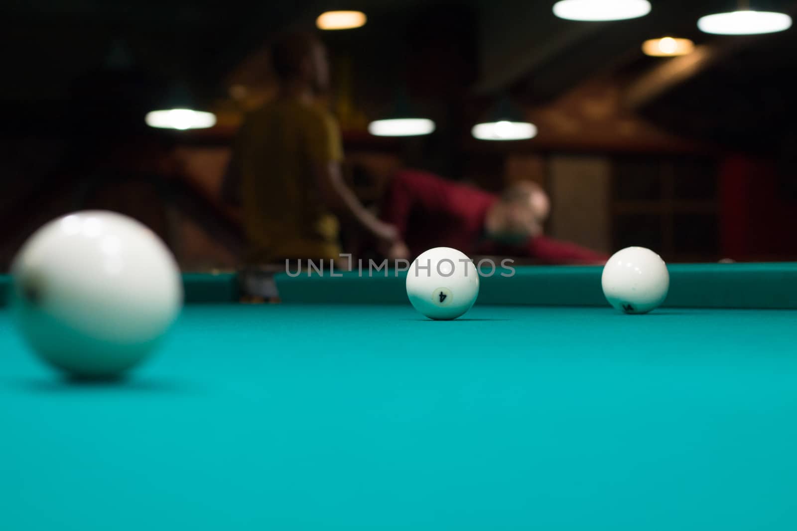 Russian billiard in club: ball, on green game table