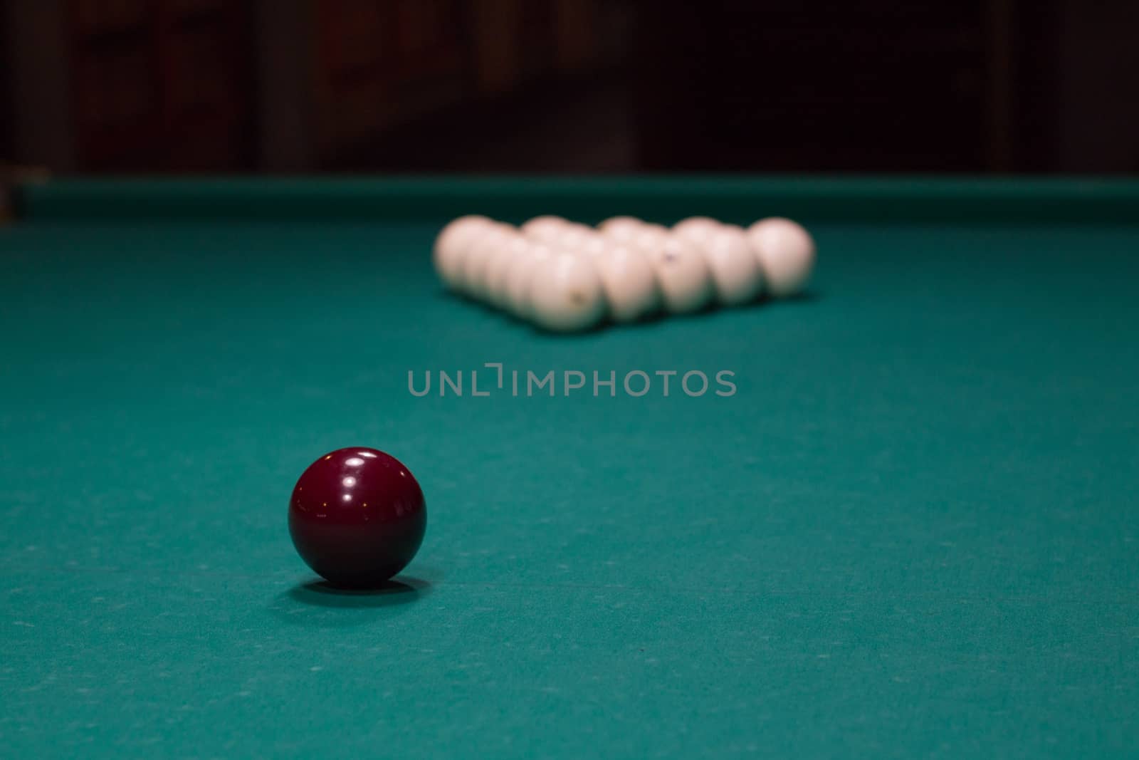 Russian billiard,  red and white balls on green table cloth