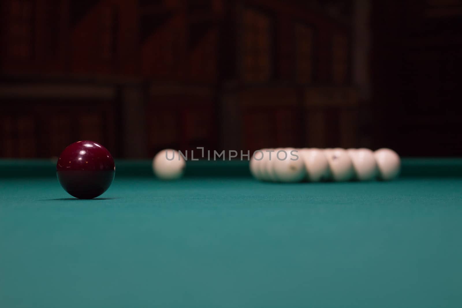 Russian billiard,  black and white balls on green game table