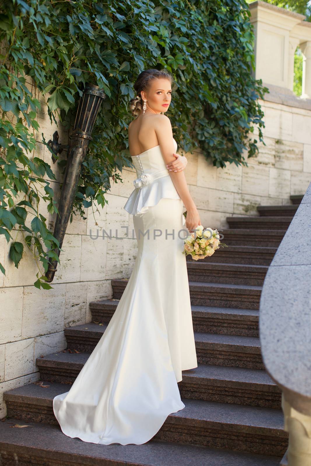 The bride in a white dress with a train