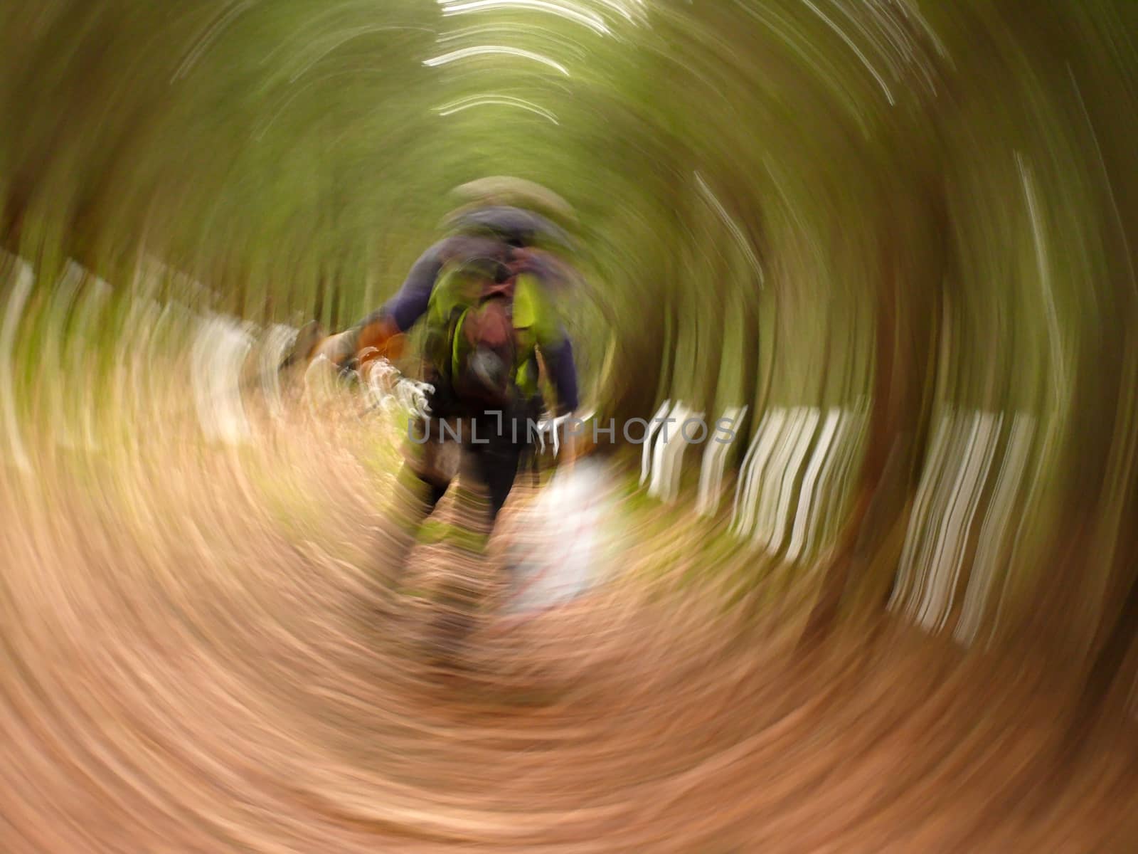 abstract Photo out of focus roundabout. man with backpack in forest. Can be used as background