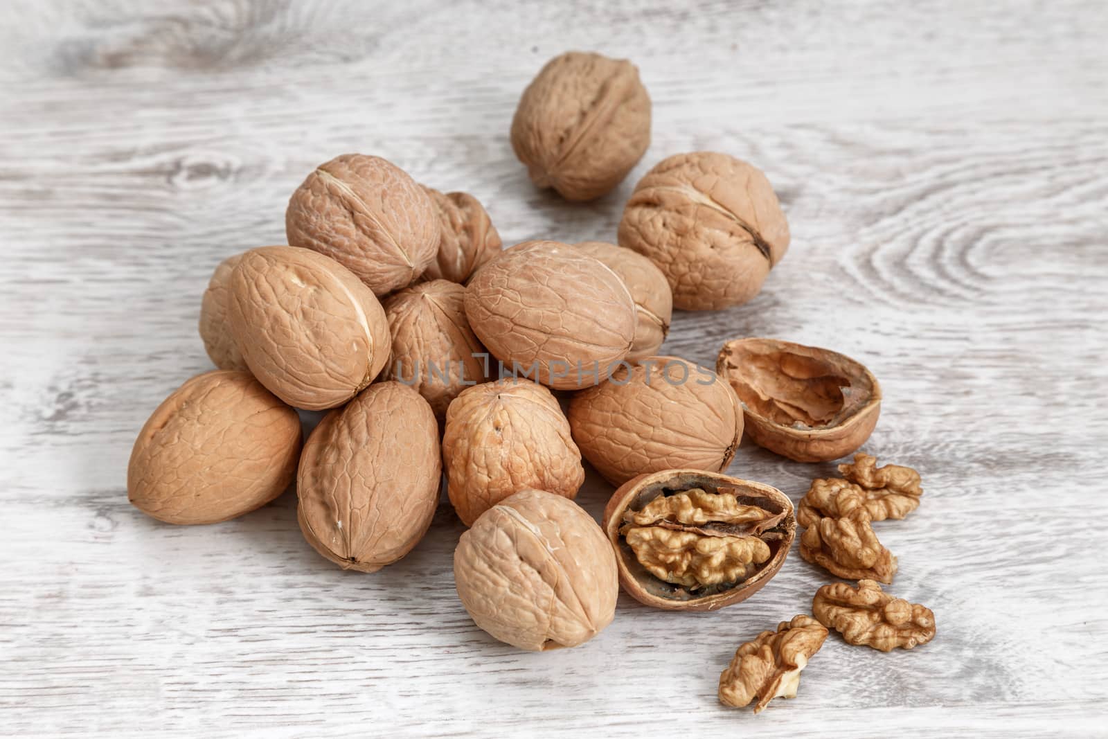 Walnuts whole in their skins, chopped, nut hulls, walnut kernels