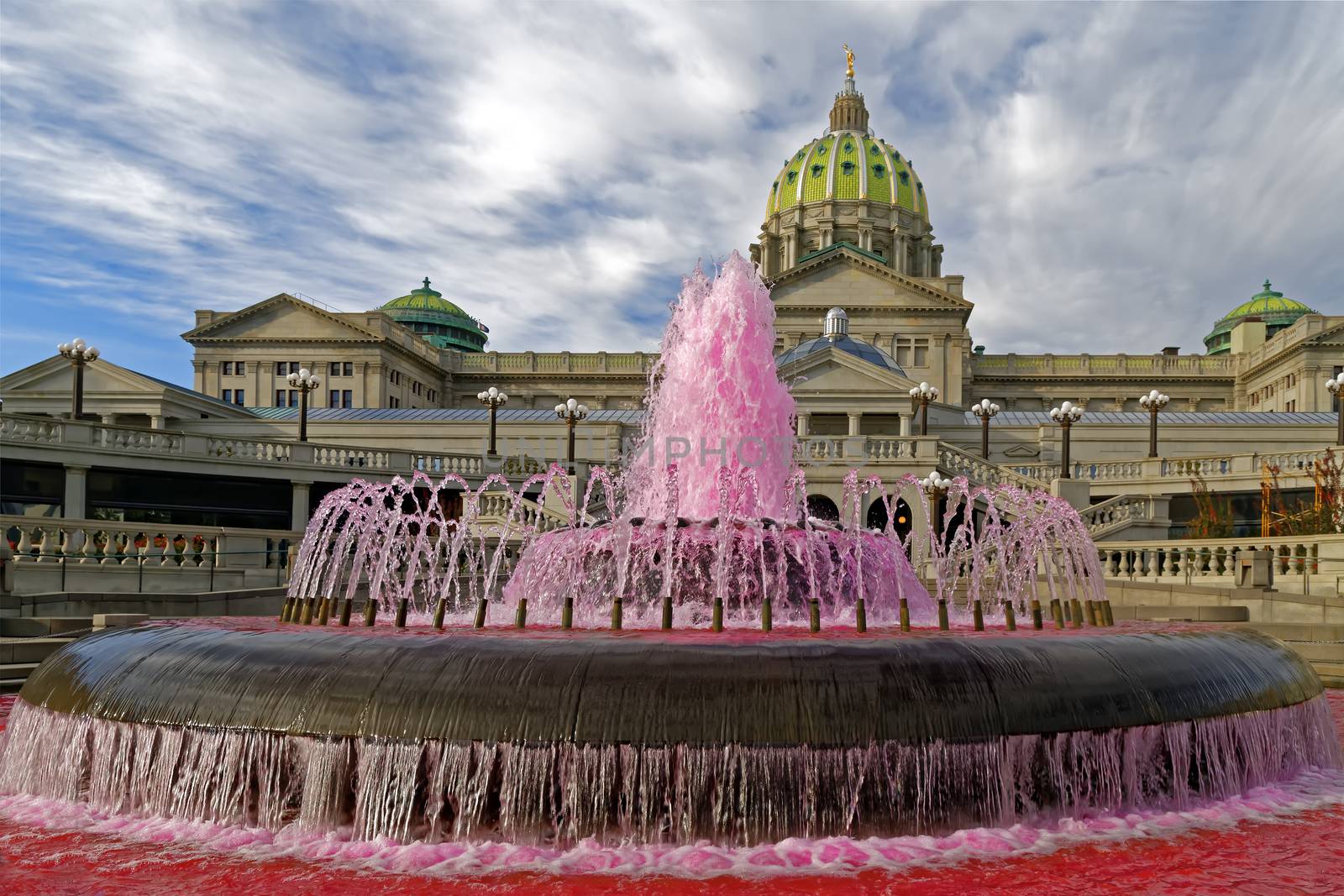 The waters in the Capitol East Wing fountain are dyed pink signifying the start of Breast Cancer Awareness Month in October. Harrisburg, Pennsylvania, USA.