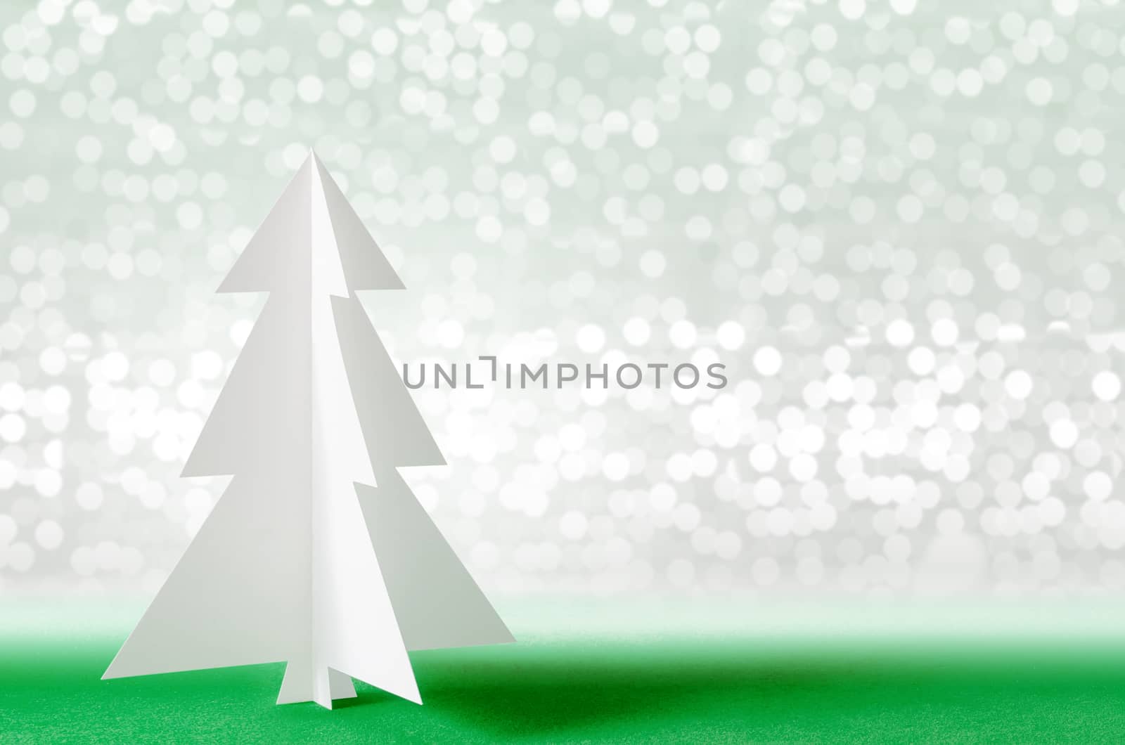 Christmas tree with lights snow winter background. Christmas tree paper craft.