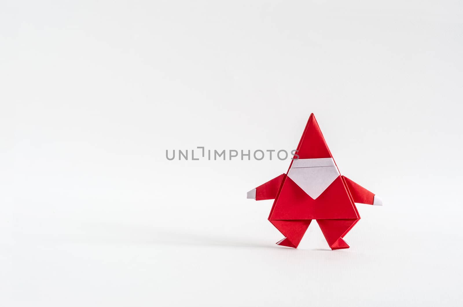 Santa Claus paper craft on white background. Paper origami.
