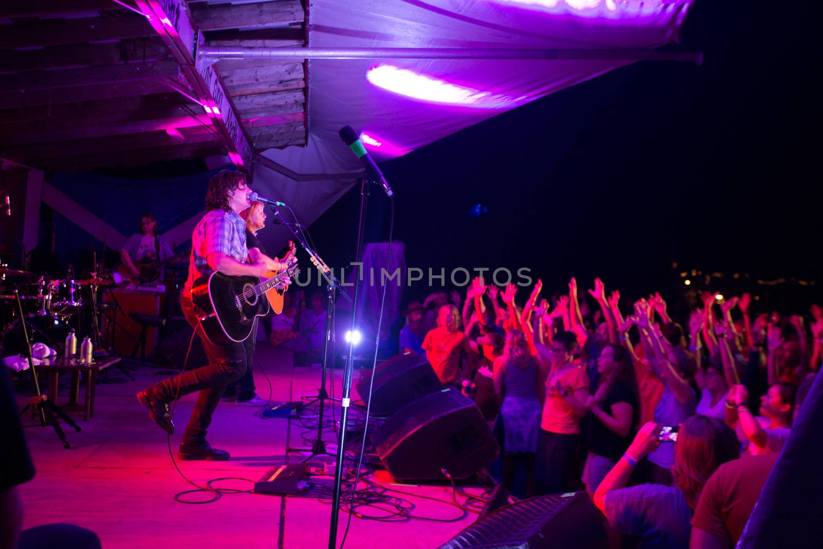 HOT SPRINGS, NC - AUGUST 10: An excited crowd waves while the Indigo Girls perform on stage at the Christian themed Wild Goose Festival on August 10, 2013 in Hot Springs, NC, USA