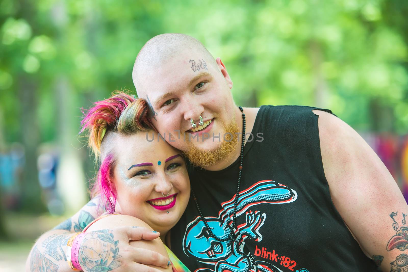 HOT SPRINGS, NC - JULY 8: Happy young adult couple outdoors at the Wild Goose Festival on July 8, 2016 in Hot Springs, NC, USA.