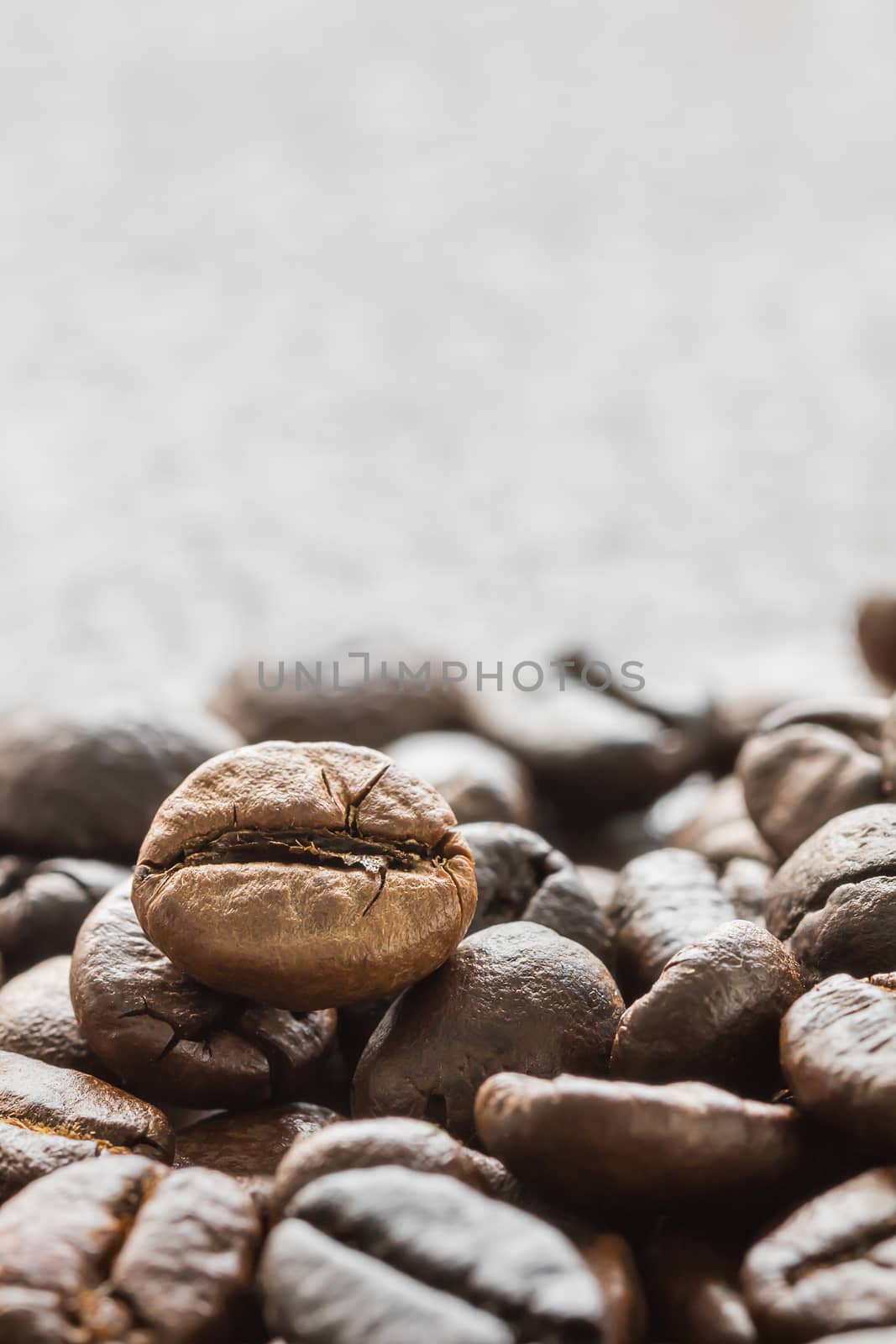 Close up heap of roasted brown coffee beans