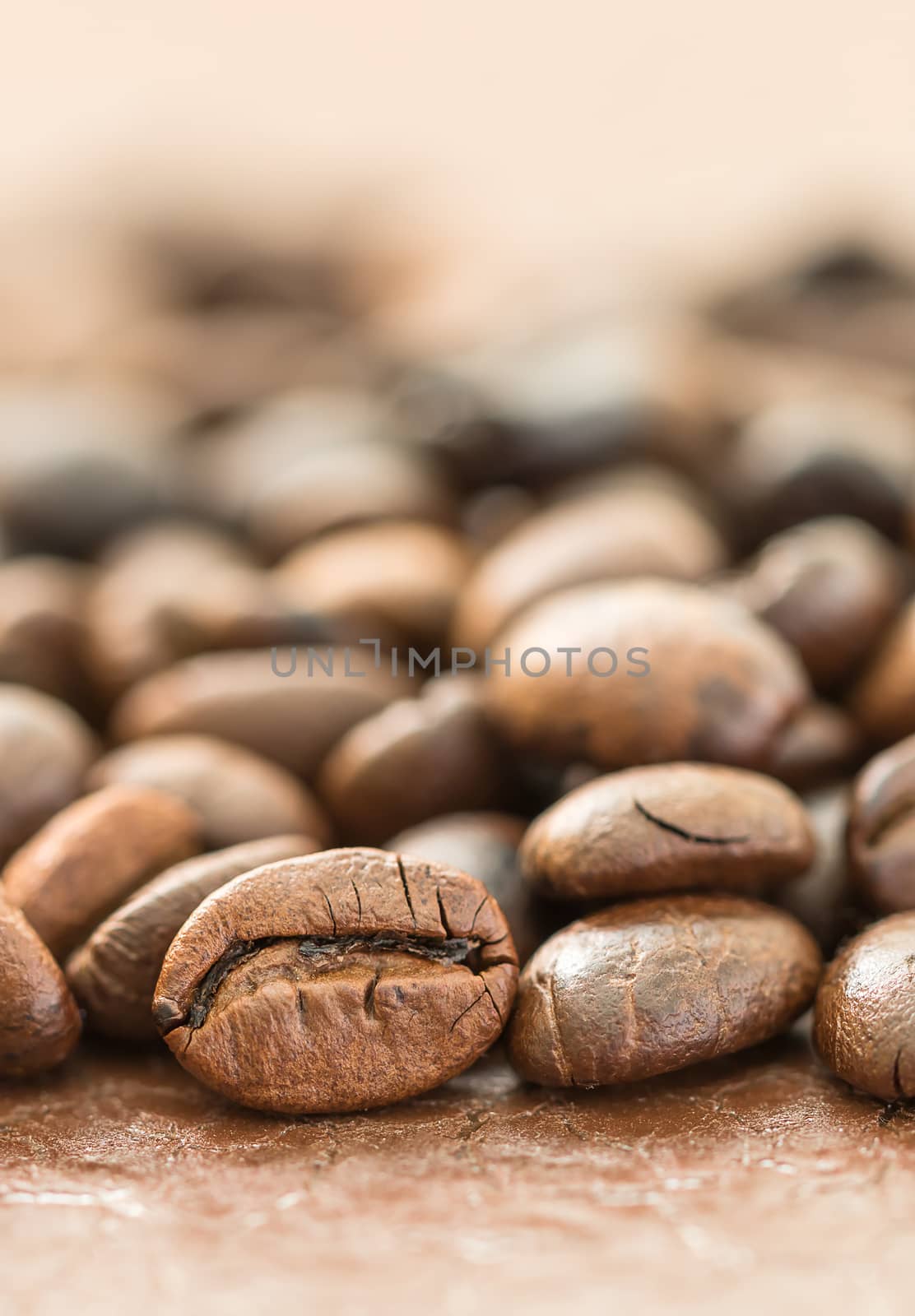 Close up heap of roasted brown coffee beans