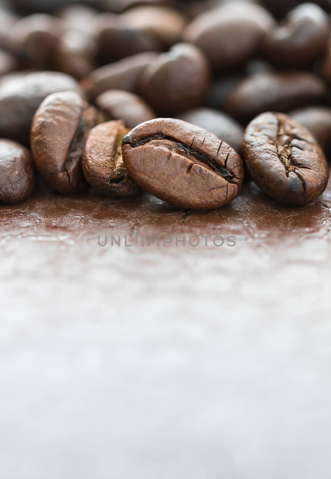 Close up heap of roasted brown coffee beans