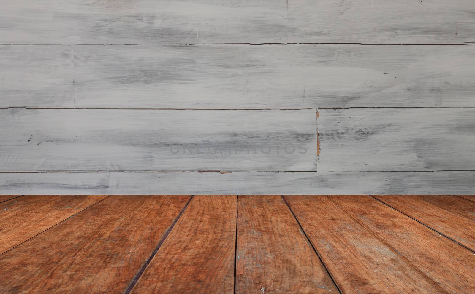 Perspective table top with white wooden wall background by punsayaporn