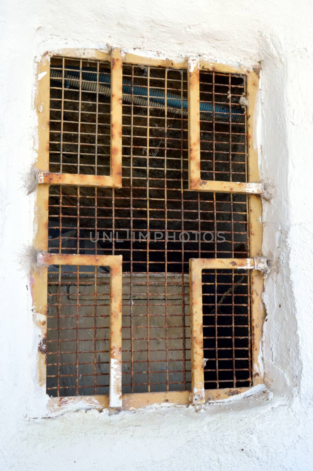 Railing of window in the shape of iron cross.