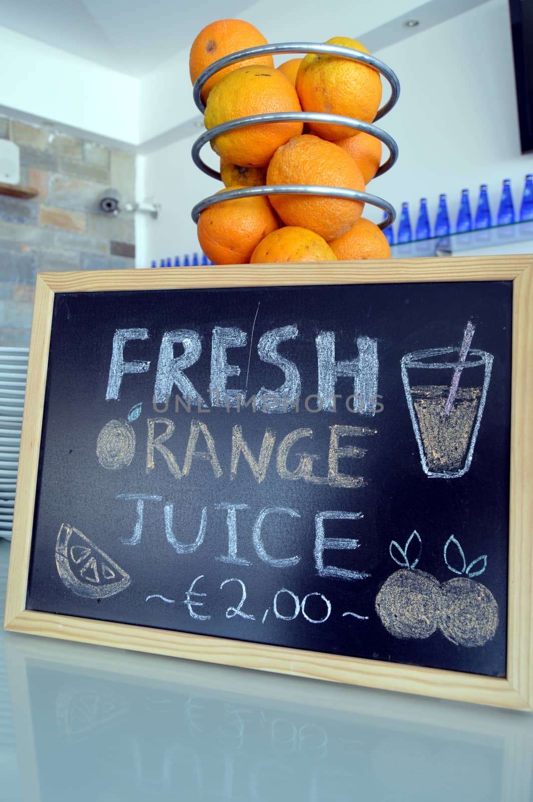 Panel fresh orange juice on a counter.