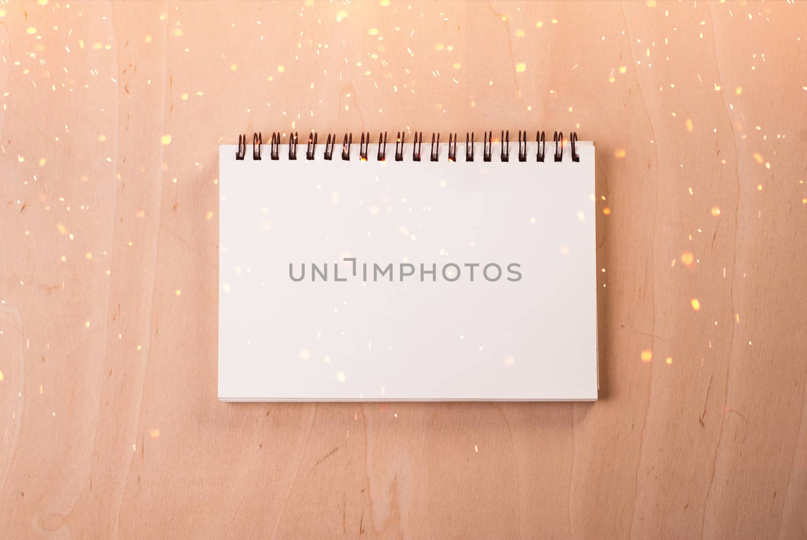 Blank notepad on a wooden surface.