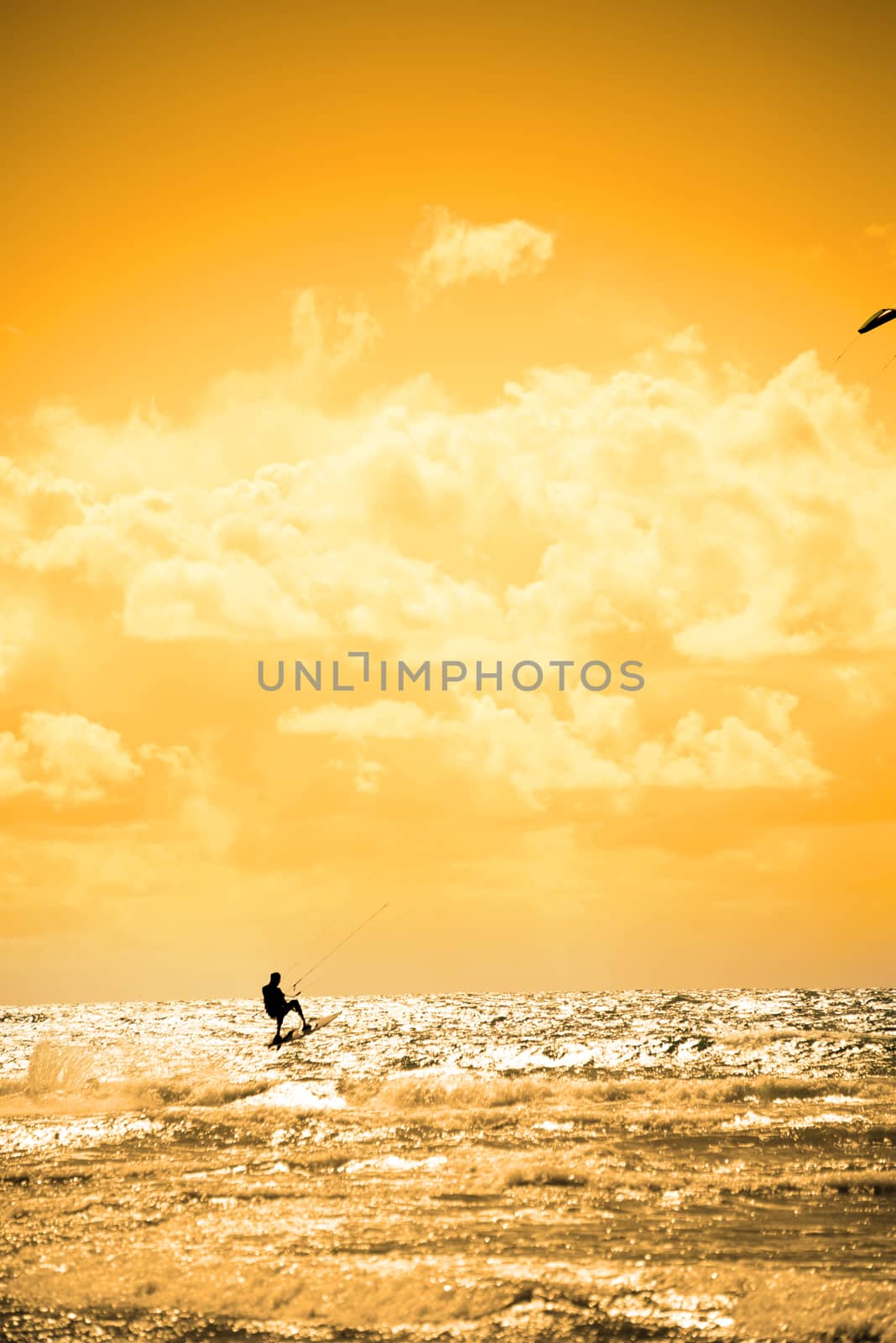 extreme kite surfer jumping waves at beach in ballybunion county kerry ireland on the wild atlantic way